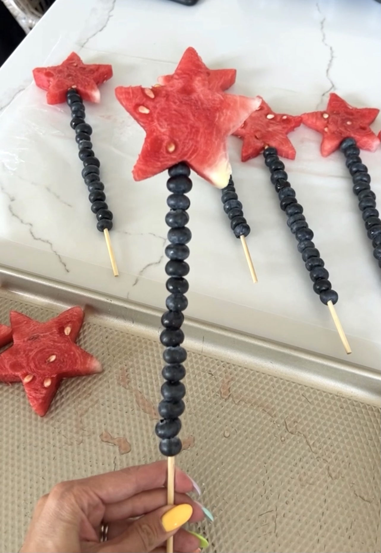 Fourth of July, 5 party hacks, 4th of July party, festive fruit, verisimilitude coordinated fruit, charcuterie spread, party spread, charcuterie board, Sams club, 4th of July, 4th of July charcuterie board, fruit sparklers, watermelon stars, blueberries