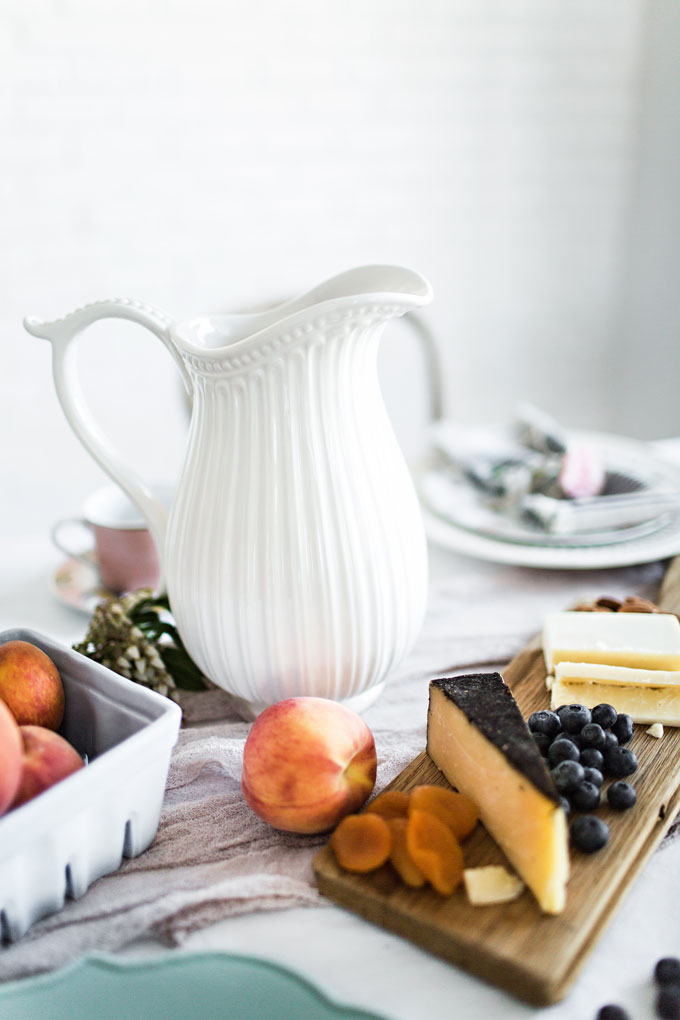 White pitcher and cheese plate