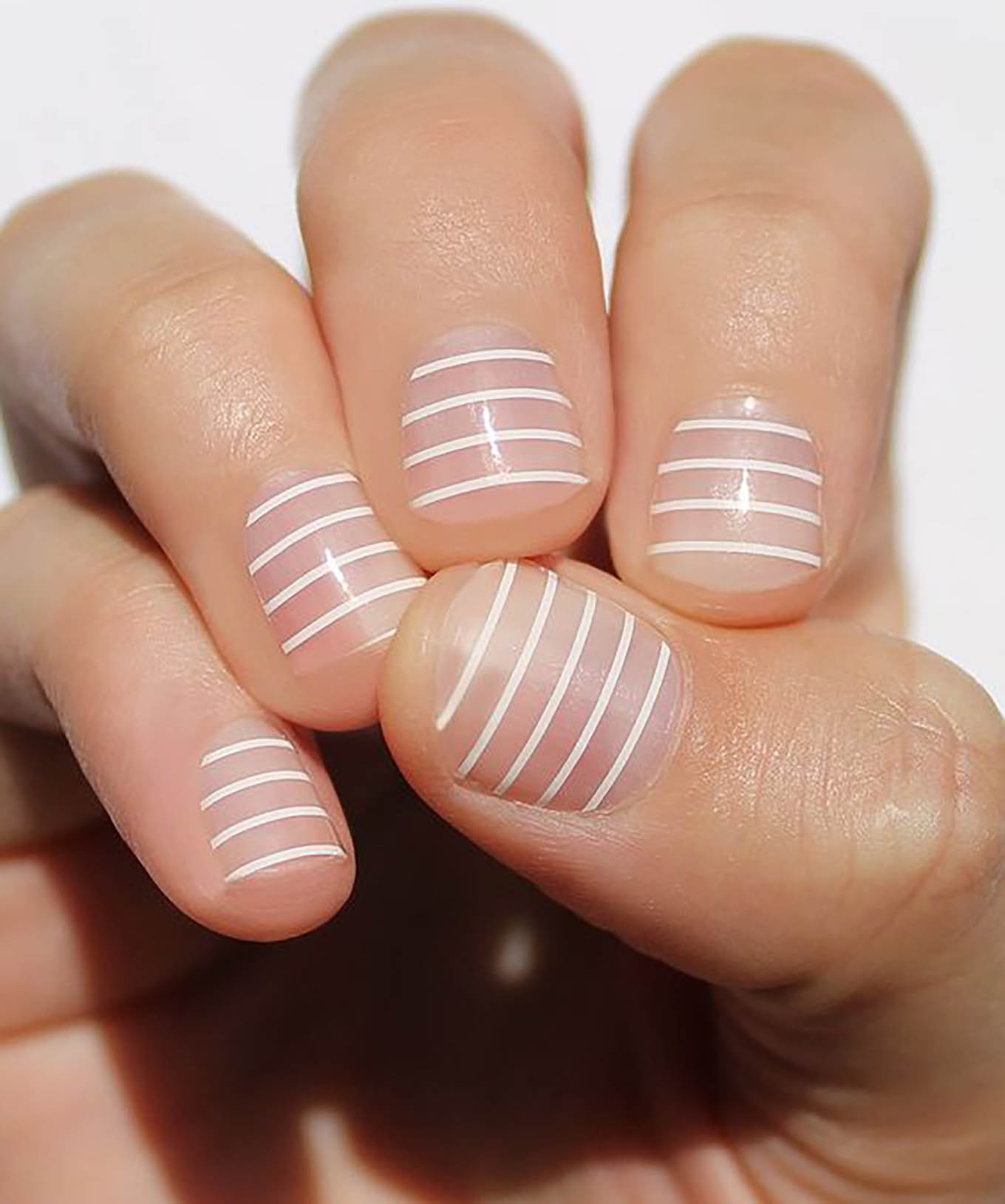 white stripe nude manicure