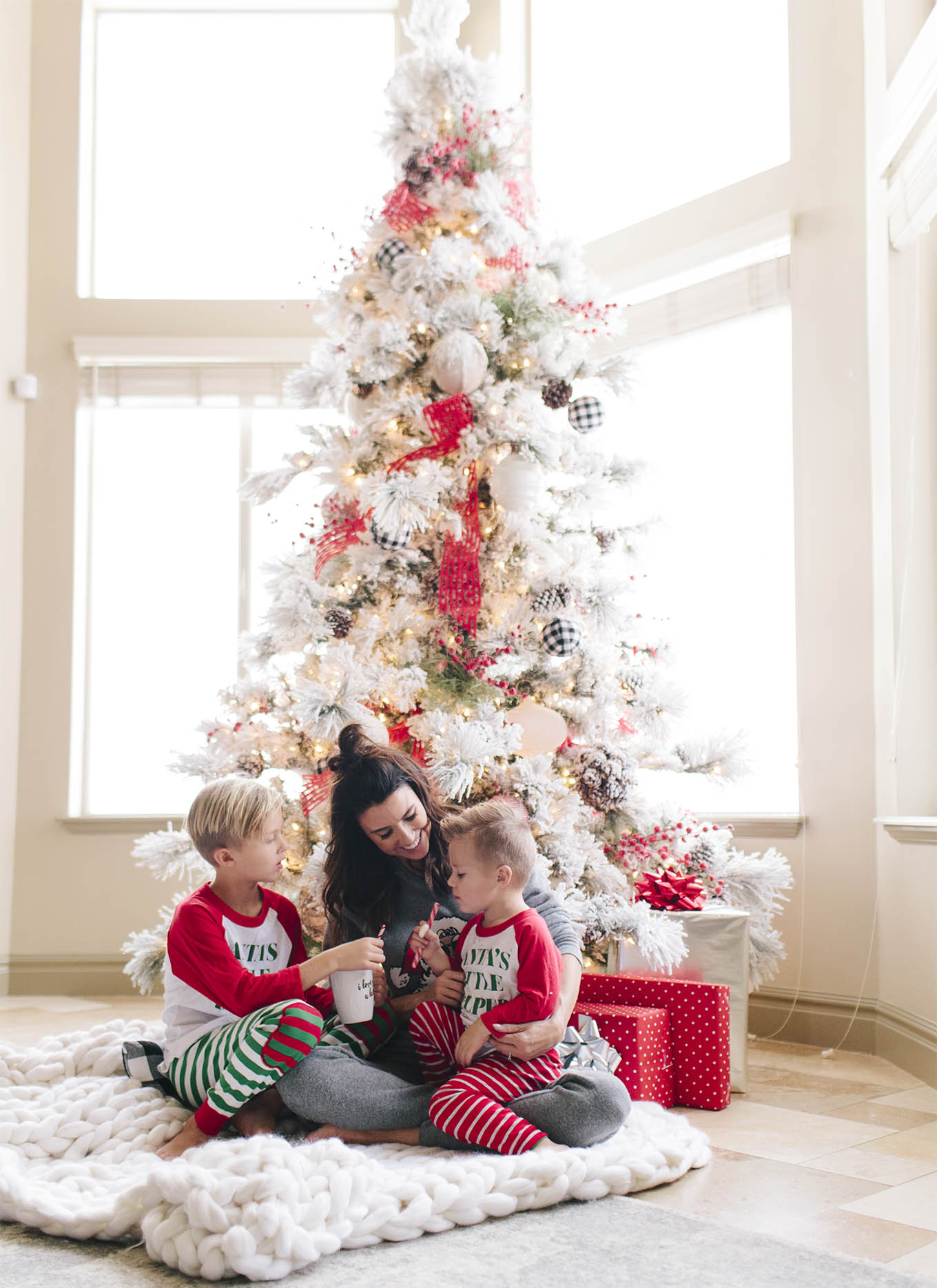 family under christmas tree