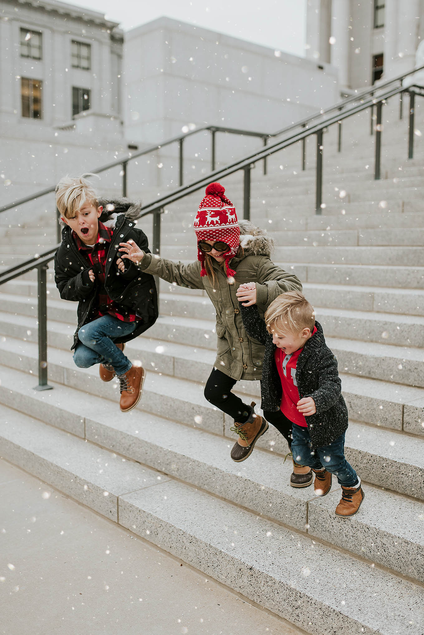 kids jumping snow