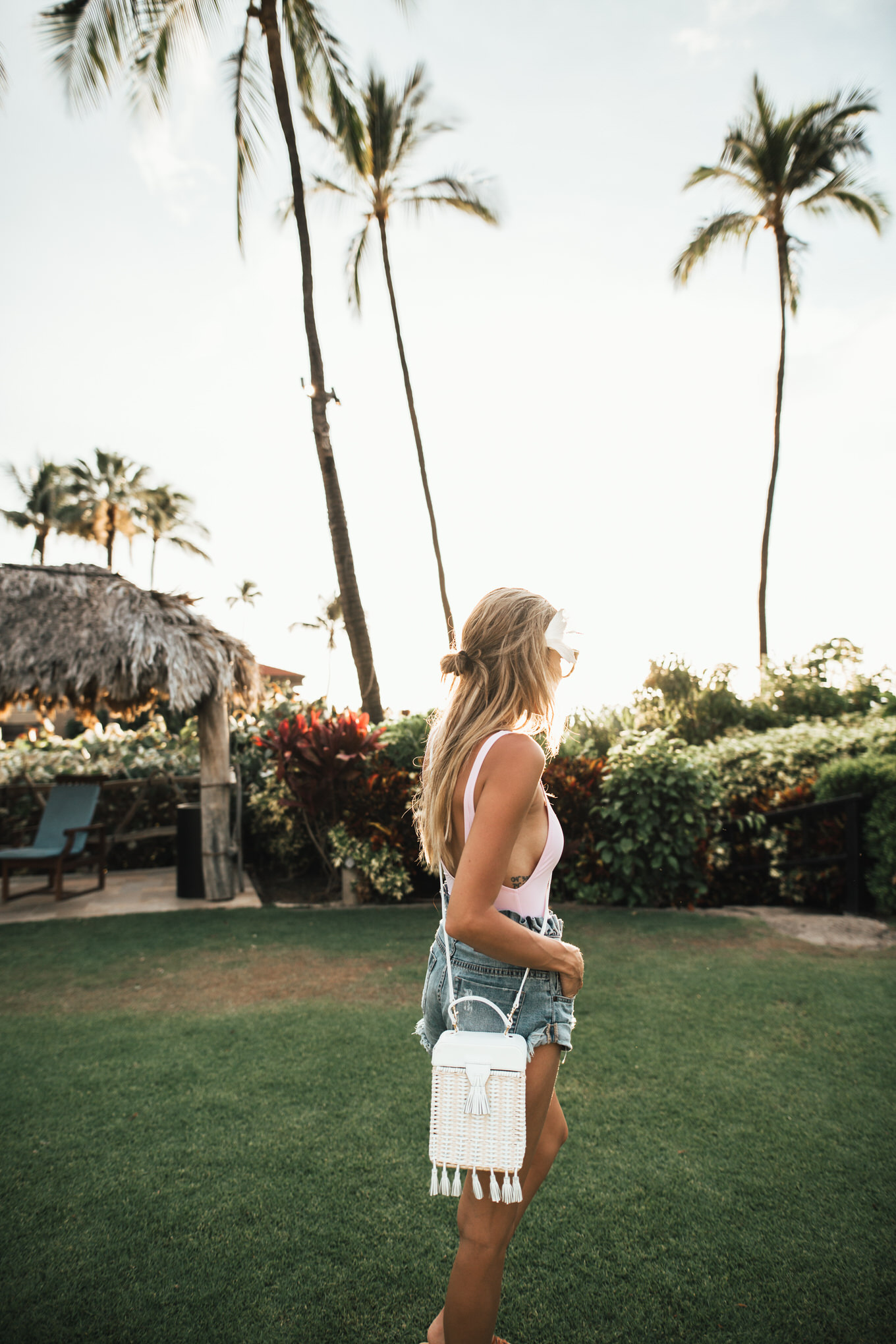 pink swimsuit and bucket bag