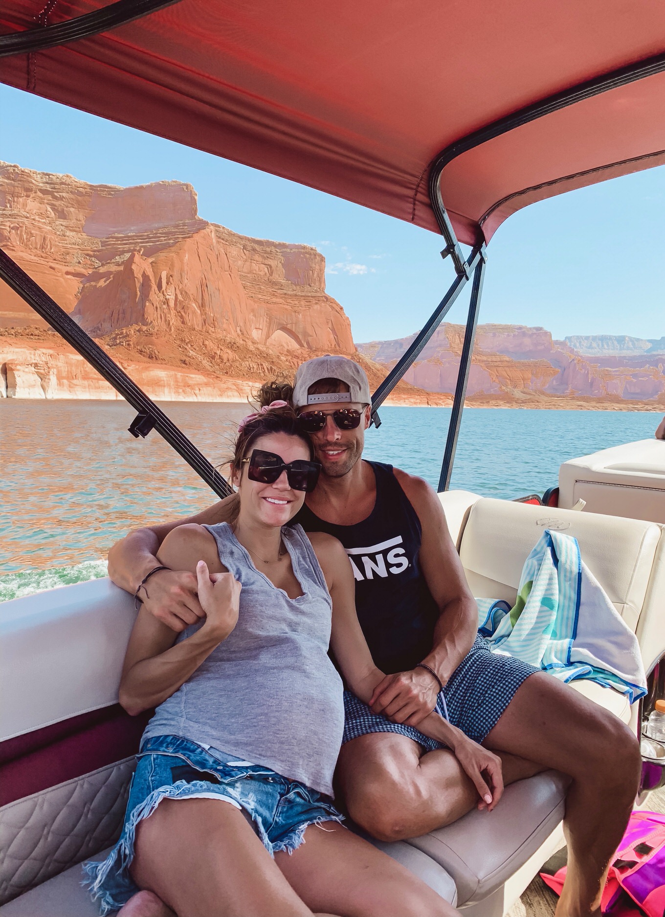 christine and cody andrew riding boat in lake powell