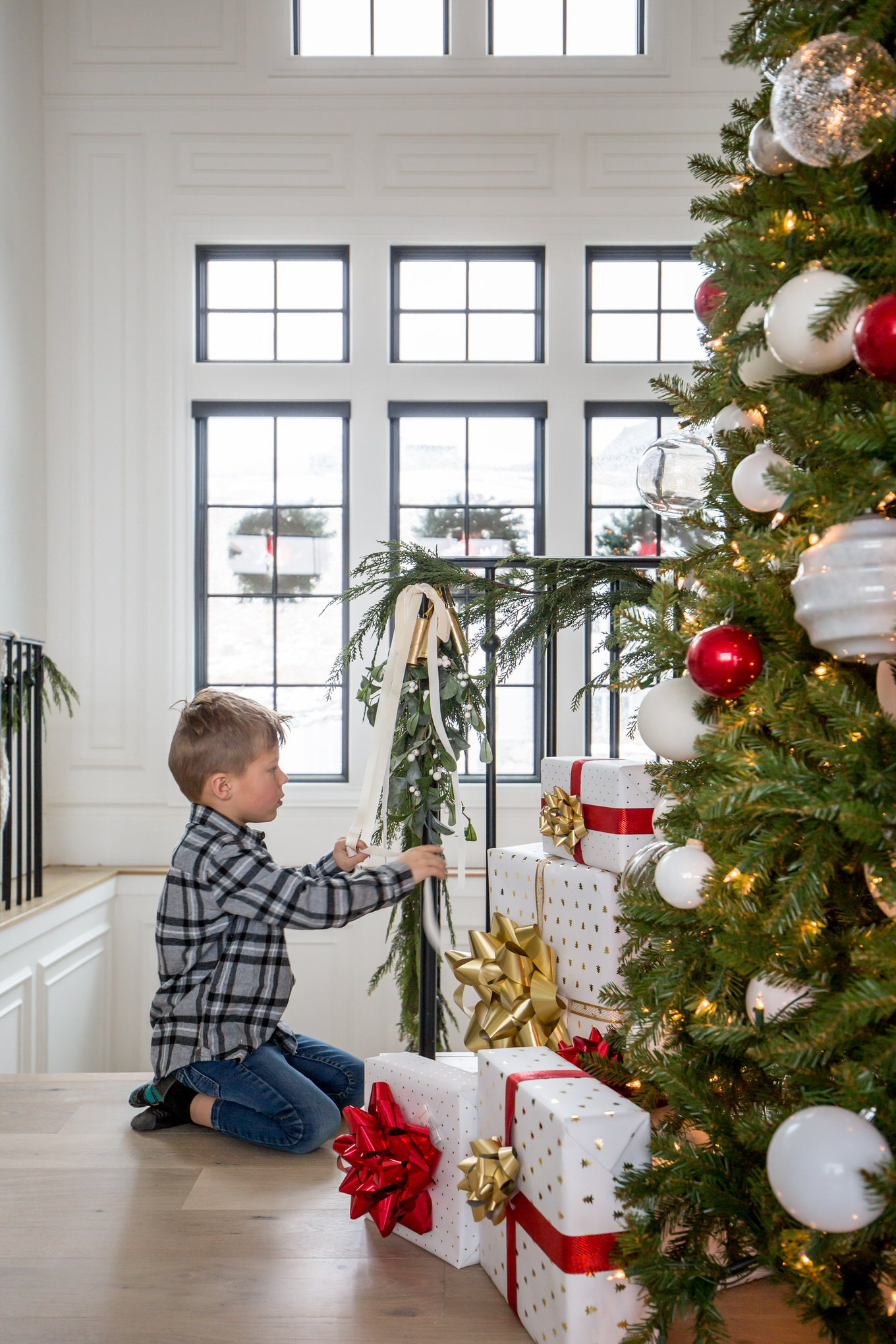 kid decorating for christmas