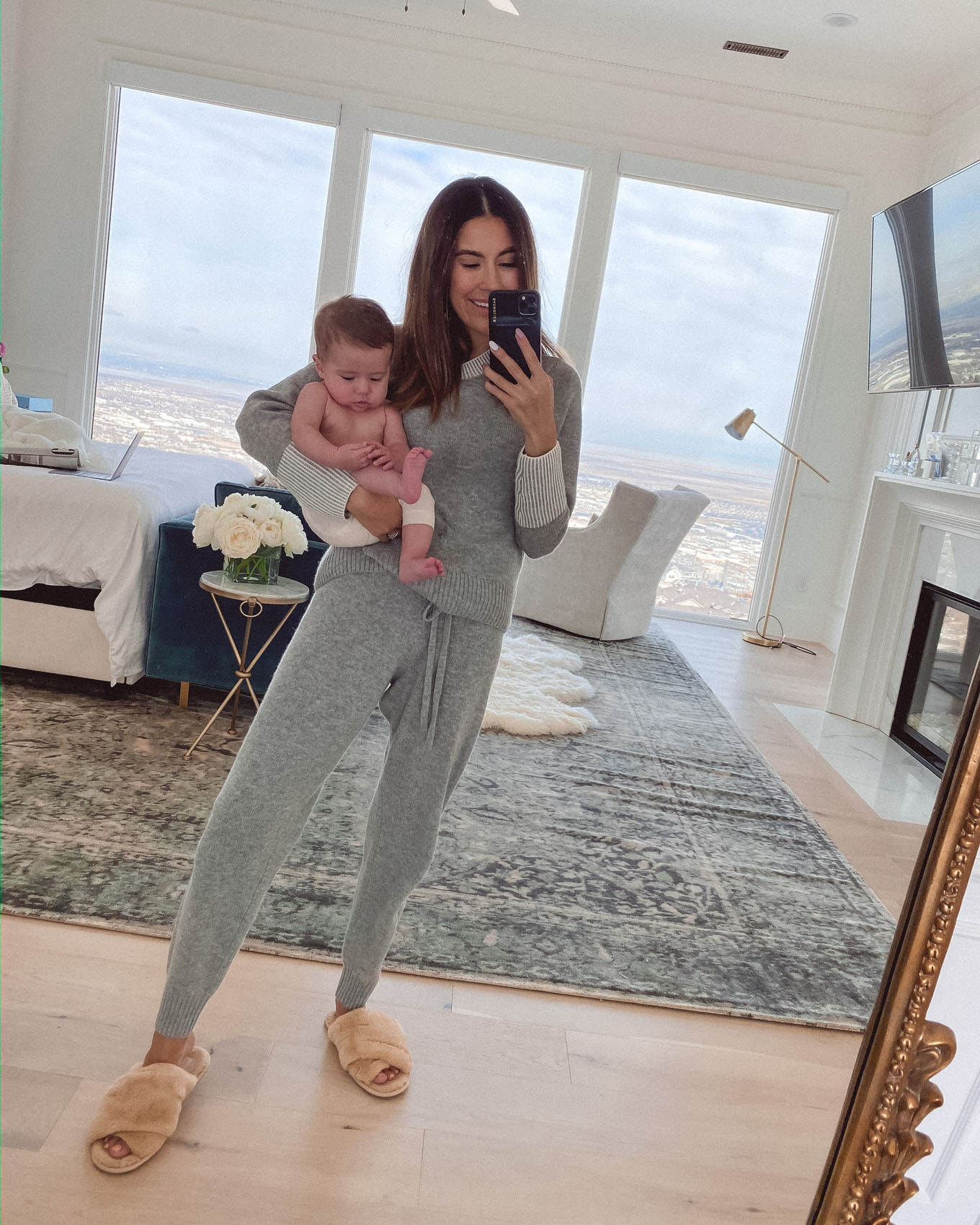 christine andrew in loungewear with baby