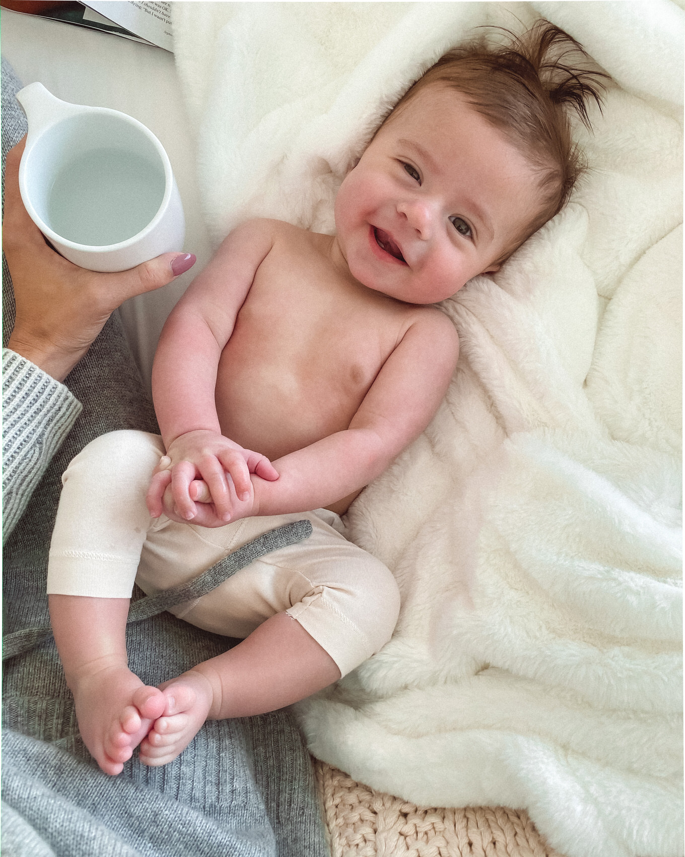 cute baby laying down looking at camera