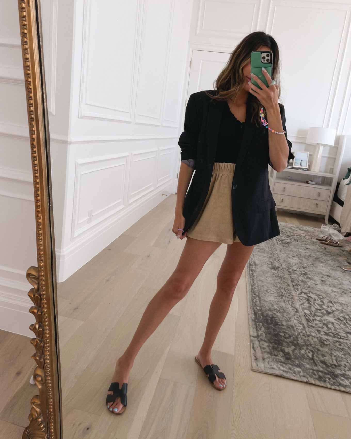 tan Terry shorts with oversized black blazer and black sandals