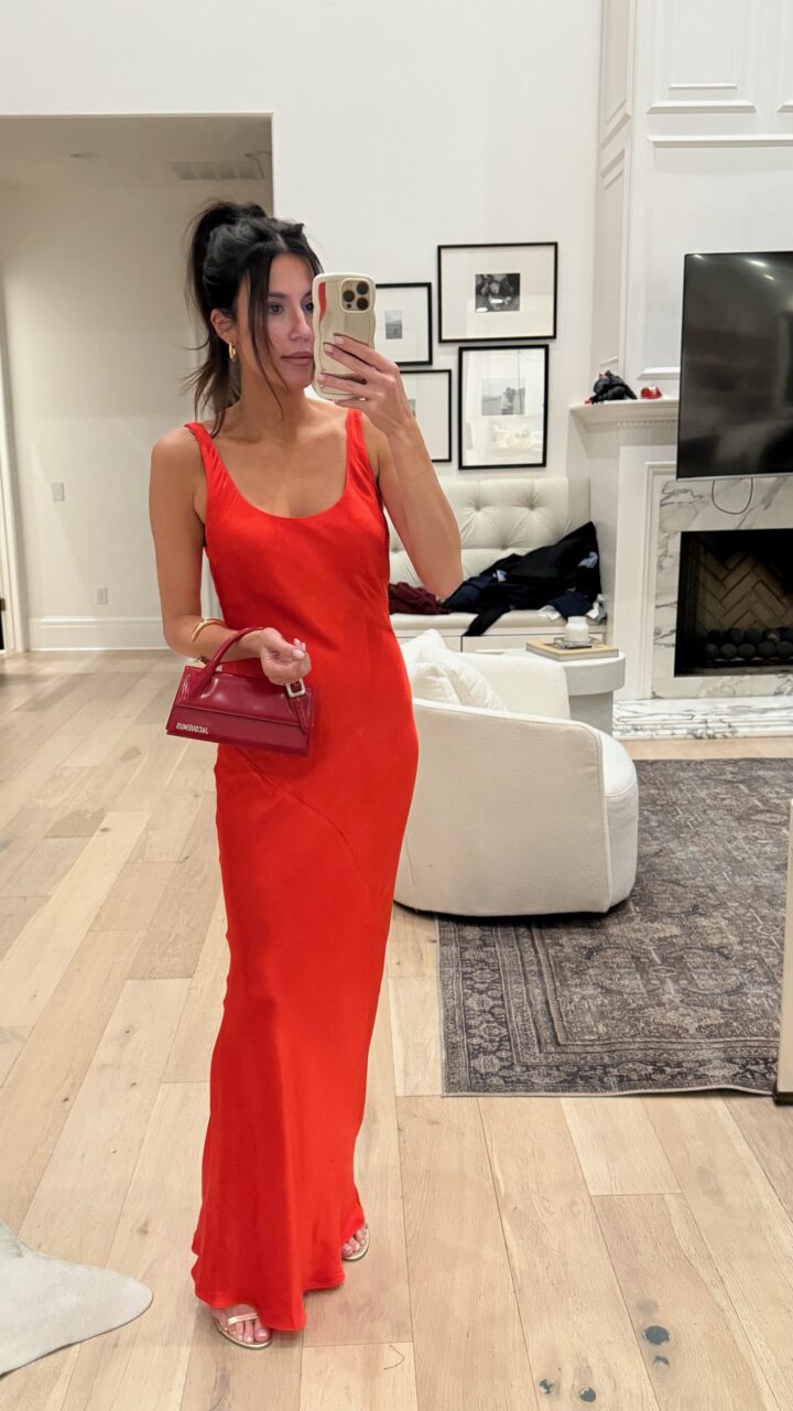 Christine Andrew in a red dress for beach vacation