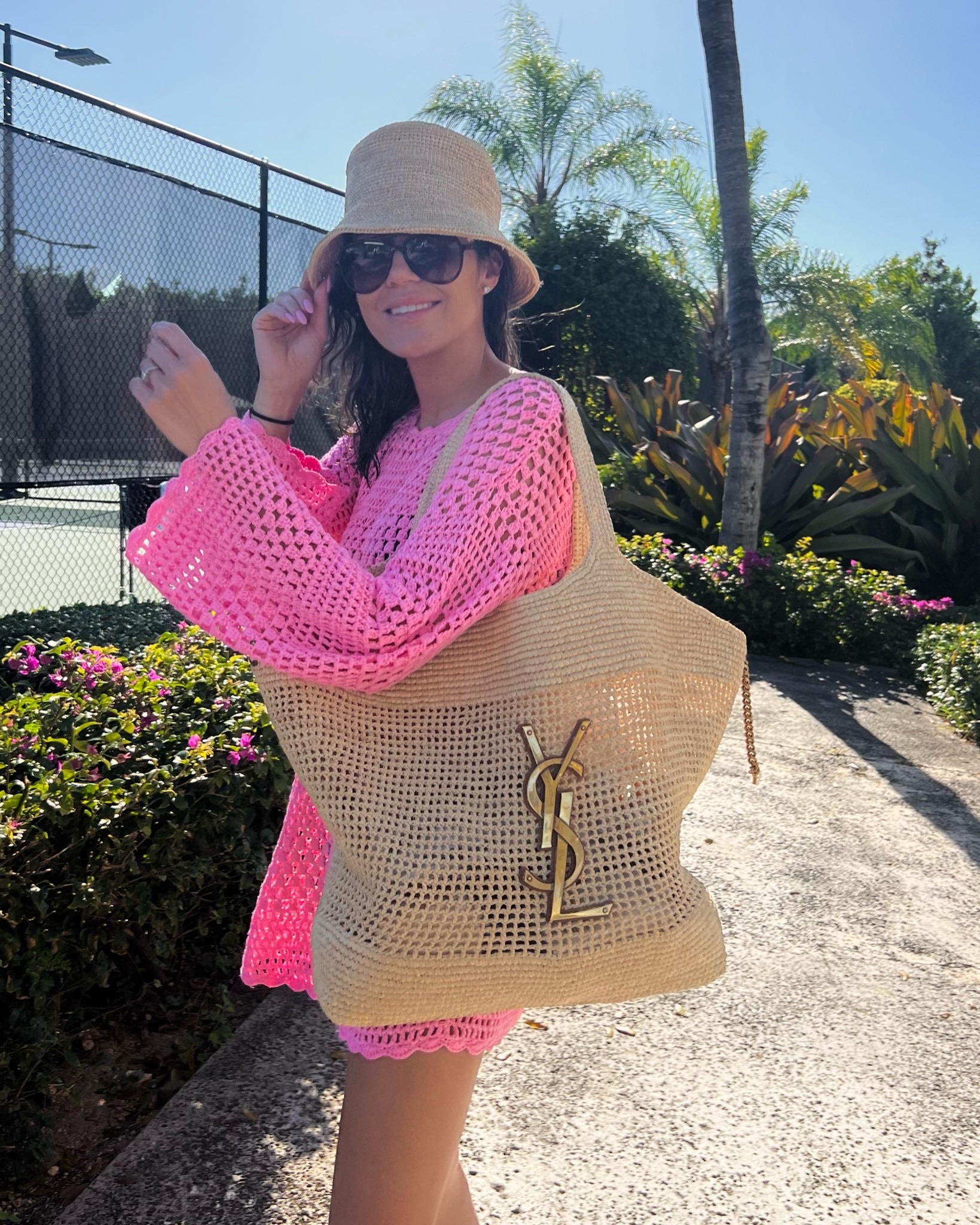 Christine Andrew in resort wear swimsuit coverup at the beach